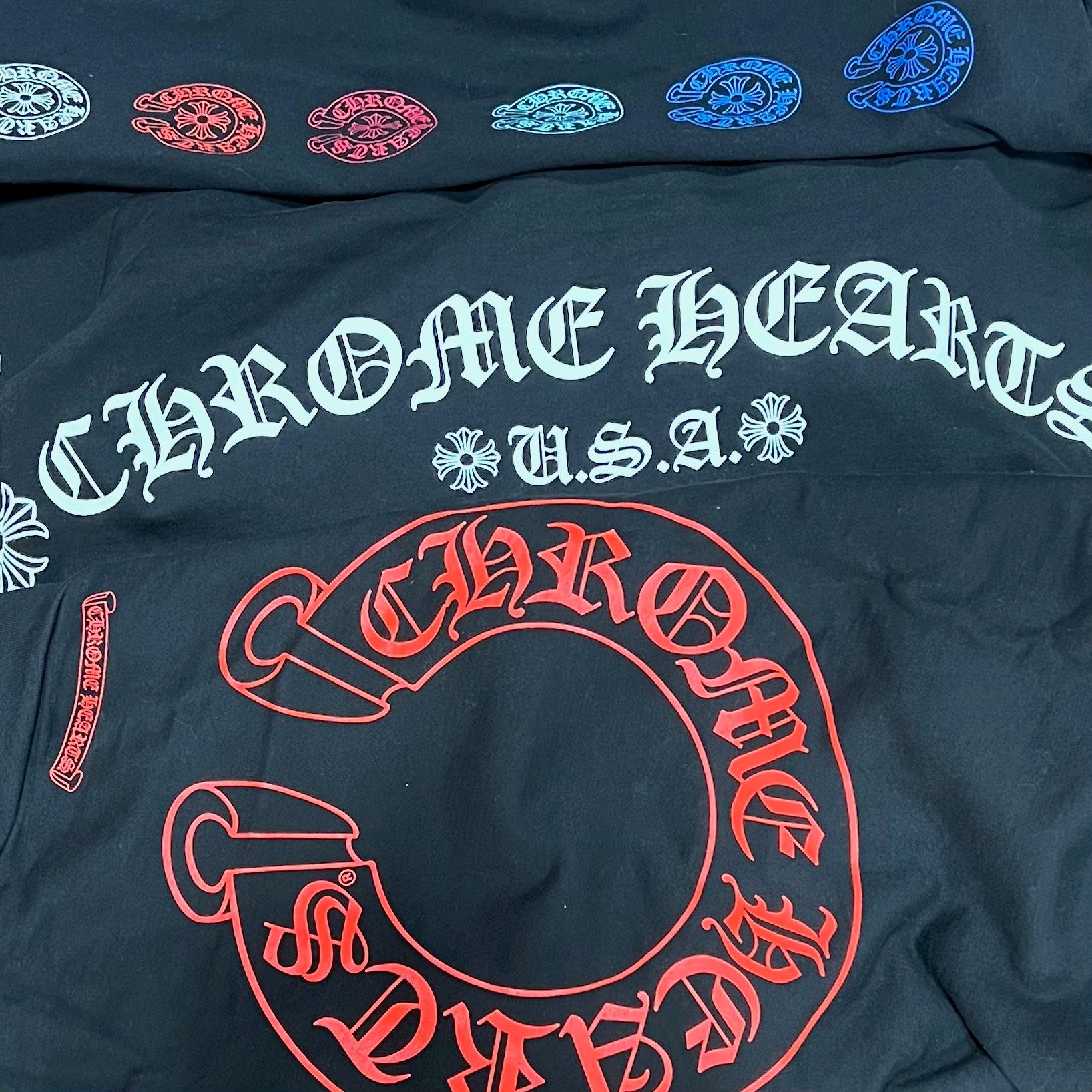 Chic Chrome Hearts apparel collection at Jawns on Fire: A stylish array of edgy streetwear pieces, featuring leather jackets, tees, and accessorie with distinctive Chrome Hearts detailing